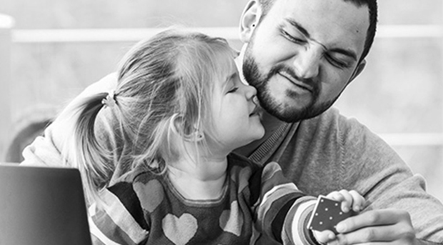 man with child making funny faces