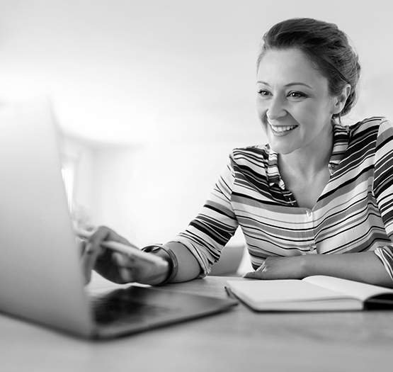 A first time home owner applying for the First Home Loan Deposit Scheme using a laptop.