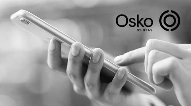 A close up of a hand using a mobile phone, with the Osko by BPAY logo in top right corner.