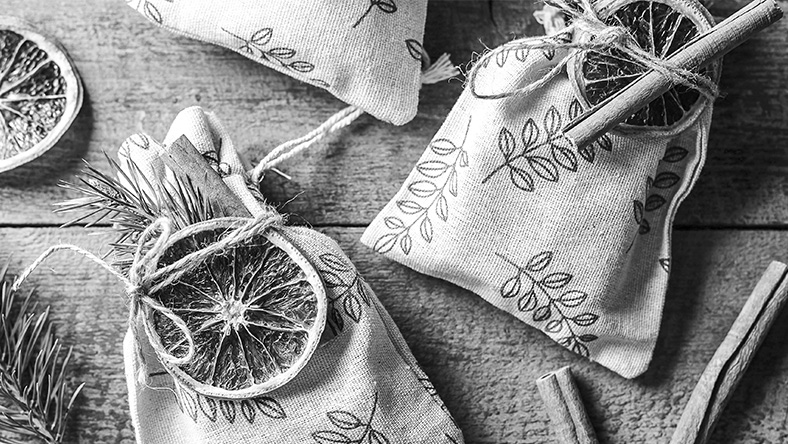 Homemade gift bags with dried citrus and cinnamon