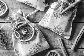 Homemade gift bags with dried citrus and cinnamon