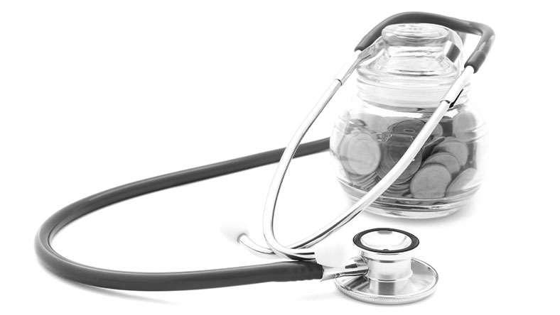 How to preform a financial health check. Image: a stethoscope draped over a coin jar. 