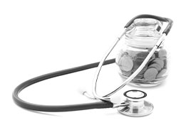 How to preform a financial health check. Image: a stethoscope draped over a coin jar. 
