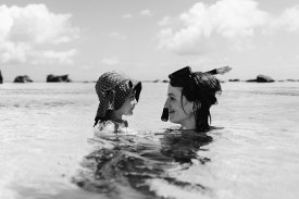 A woman and child snorkelling because she booked a holiday using a personal loan to pay for it.
