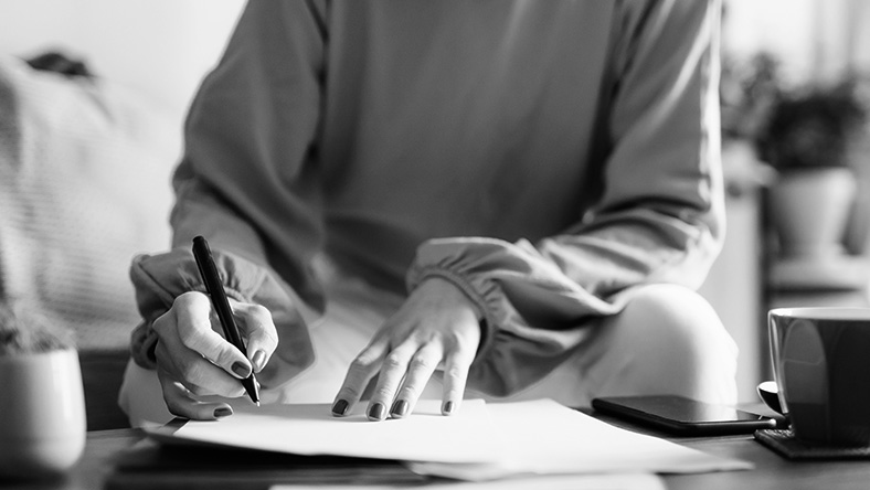 A young woman fills in home loan paperwork