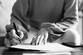 A young woman fills in home loan paperwork